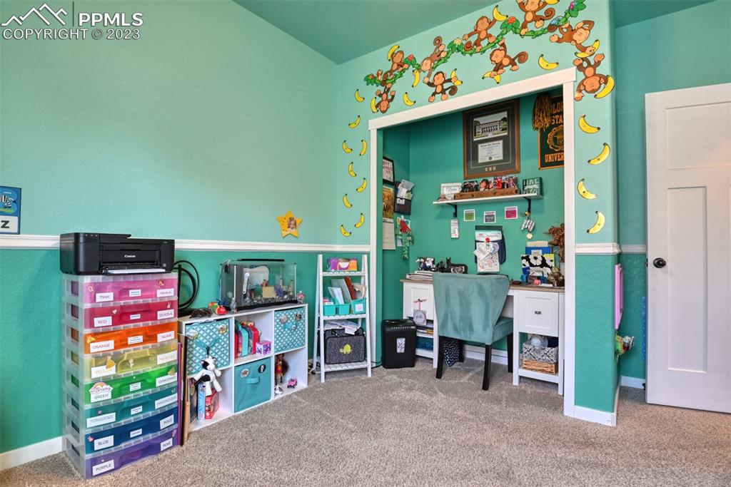 9785 Terrain Road Fountain, CO 80817 - Photo 26 of 40 a room with toys and a baby crib