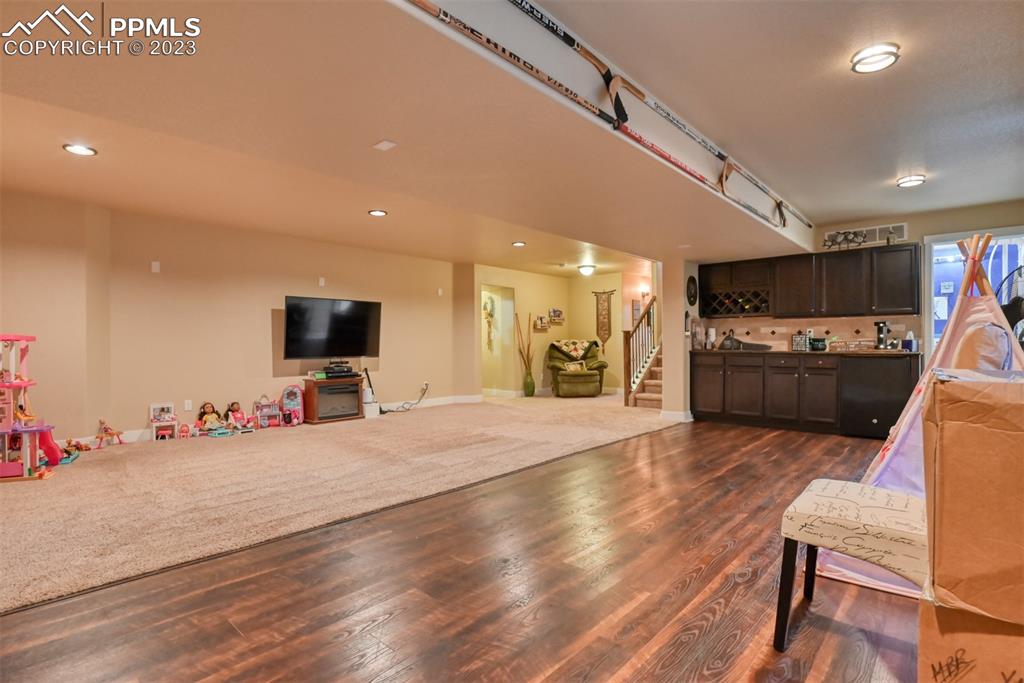 9785 Terrain Road Fountain, CO 80817 - Photo 28 of 40 a view of a livingroom with furniture and a flat screen tv