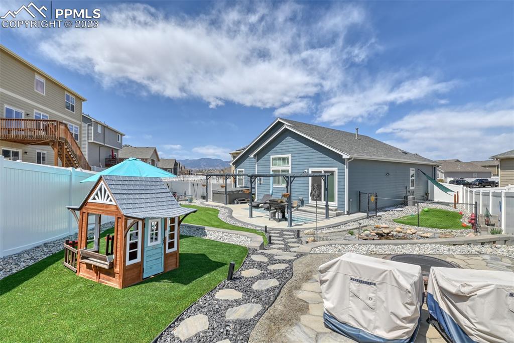 9785 Terrain Road Fountain, CO 80817 - Photo 37 of 40 a front view of a house with garden