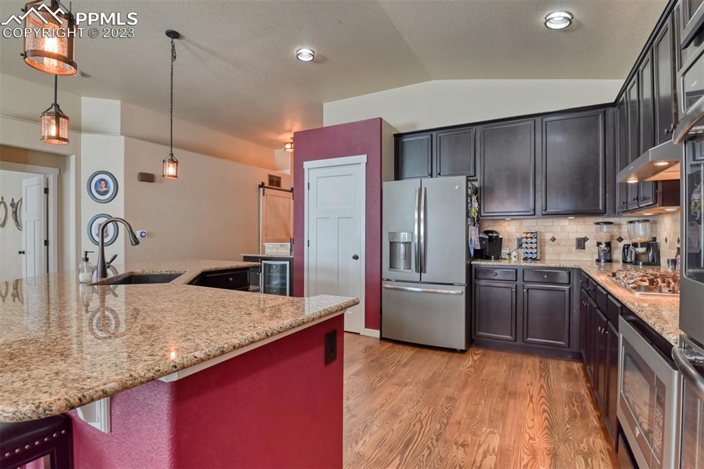 9785 Terrain Road Fountain, CO 80817 - Photo 8 of 40 a kitchen with a refrigerator sink and stove