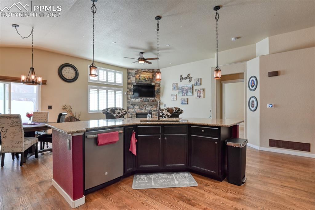 9785 Terrain Road Fountain, CO 80817 - Photo 9 of 40 a kitchen with granite countertop a sink appliances and cabinets