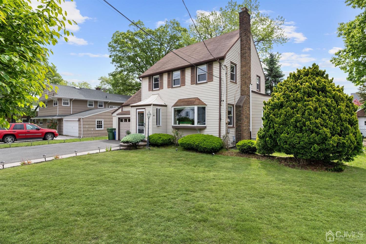 13 Edgewood Road Linden, NJ 07036 - Photo 2 of 14 a front view of a house with a garden