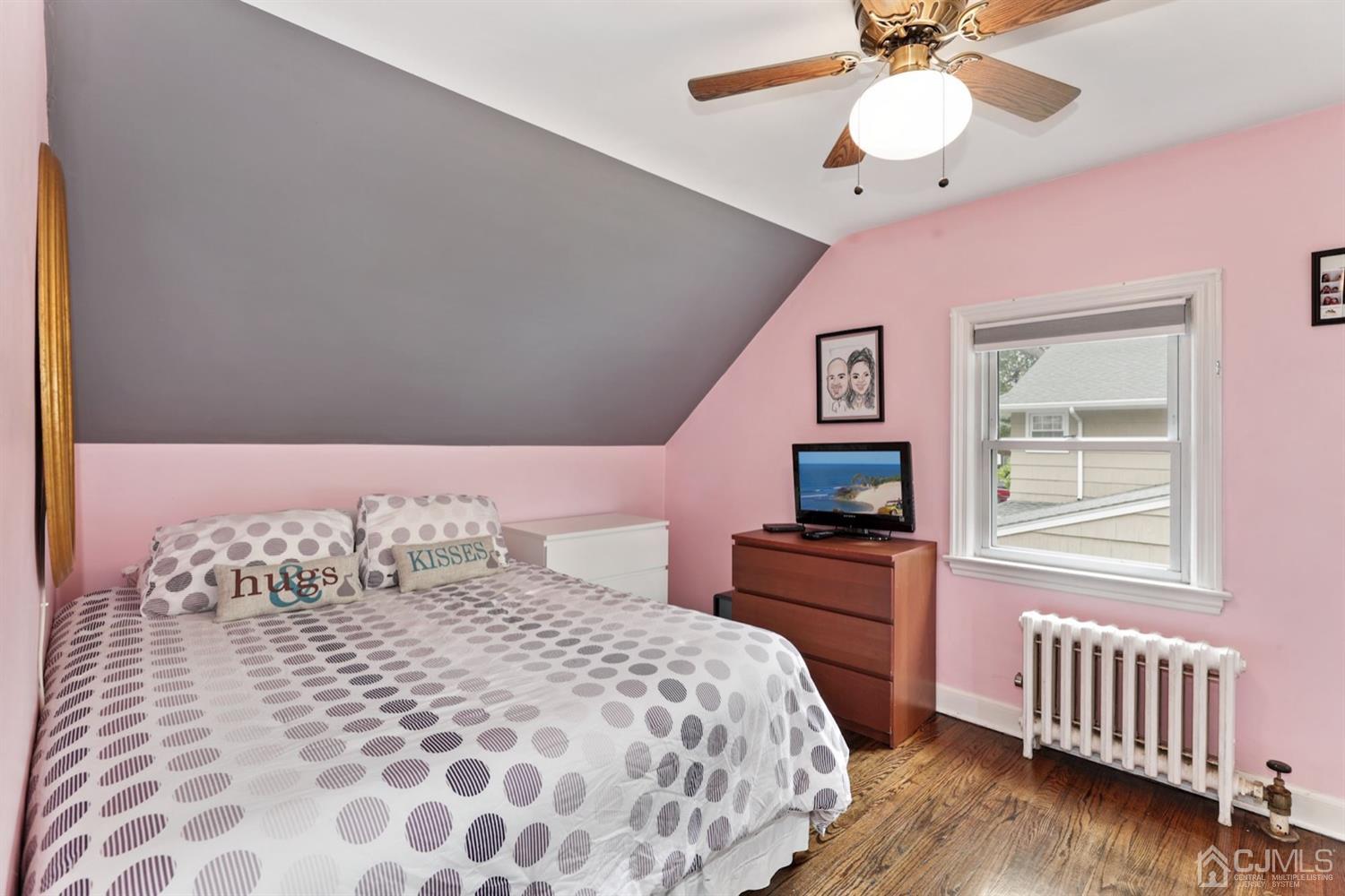 13 Edgewood Road Linden, NJ 07036 - Photo 11 of 14 a bedroom with a bed and wooden floor