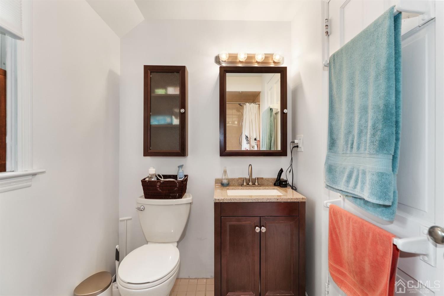 13 Edgewood Road Linden, NJ 07036 - Photo 13 of 14 a bathroom with a toilet sink and mirror
