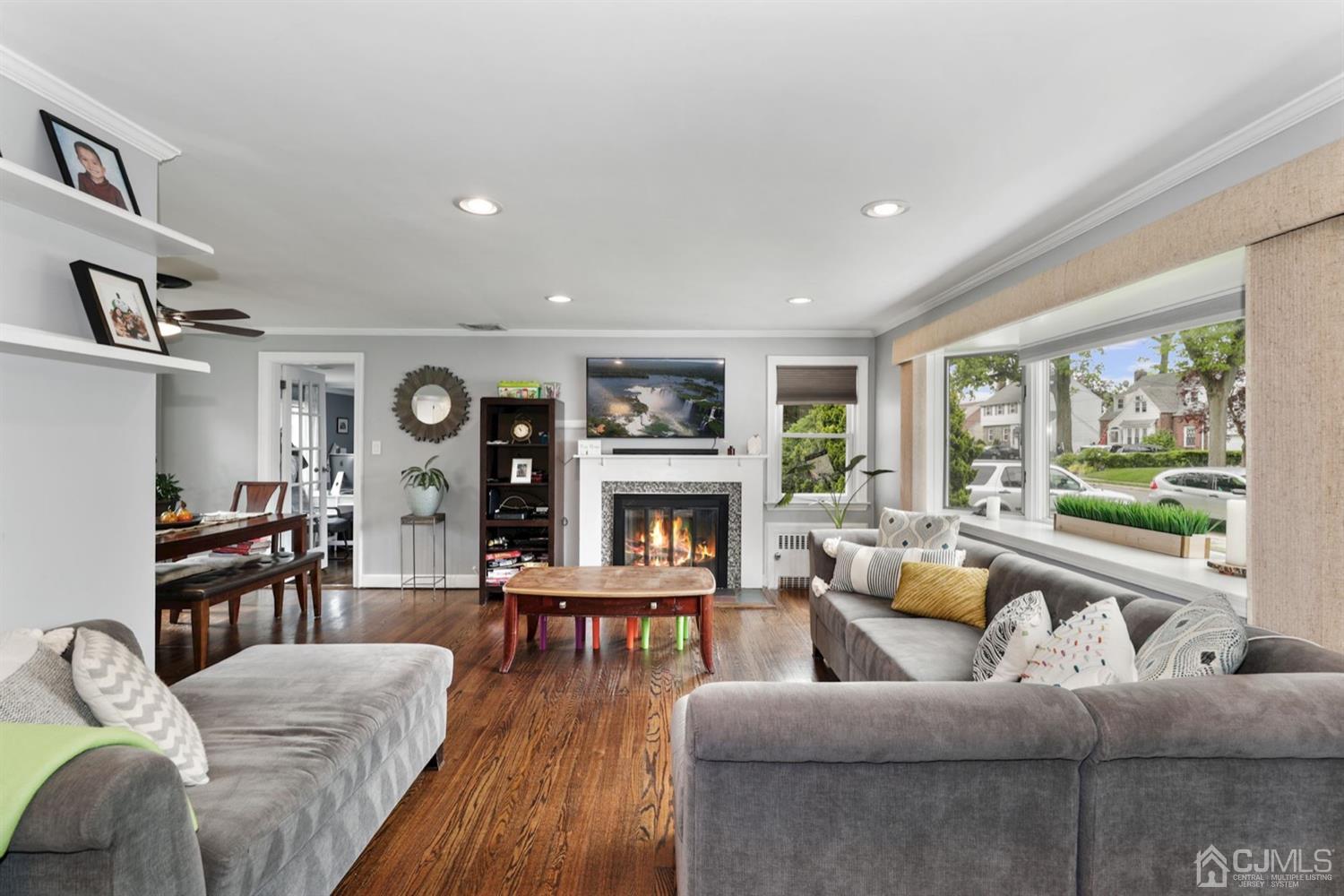 13 Edgewood Road Linden, NJ 07036 - Photo 4 of 14 a living room with fireplace furniture and a large window