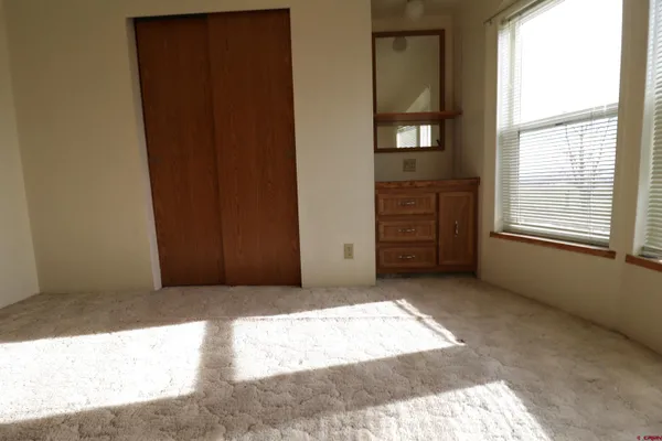 a view of a room that has a window in it
