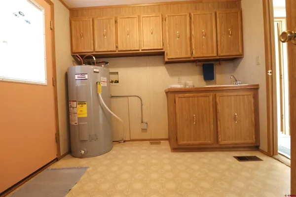 a view of storage and utility room with washer and dryer