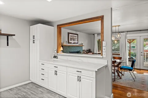 a spacious bathroom with a double vanity sink and a mirror