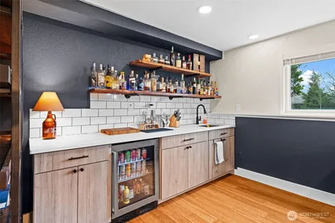 a kitchen with a sink cabinets and window