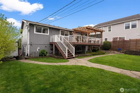 a view of a house with backyard and porch