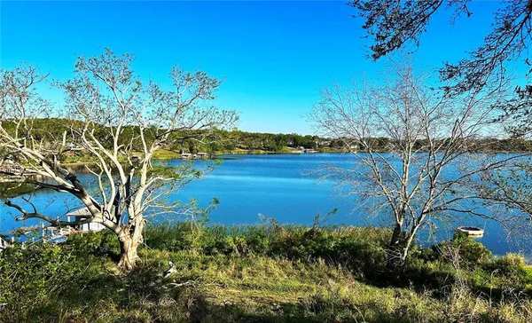 a view of a lake with a yard