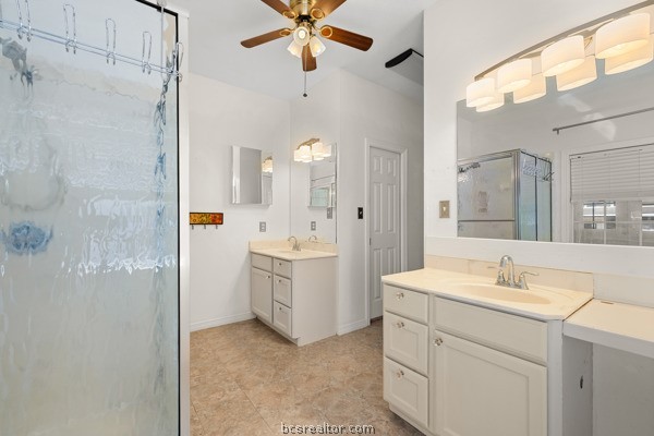 12 Raven's Nest Bryan, TX 77808 - Photo 15 of 46 a bathroom with a double vanity sink mirror and shower