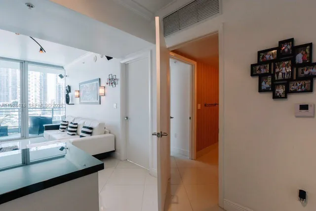 a hallway with furniture and window