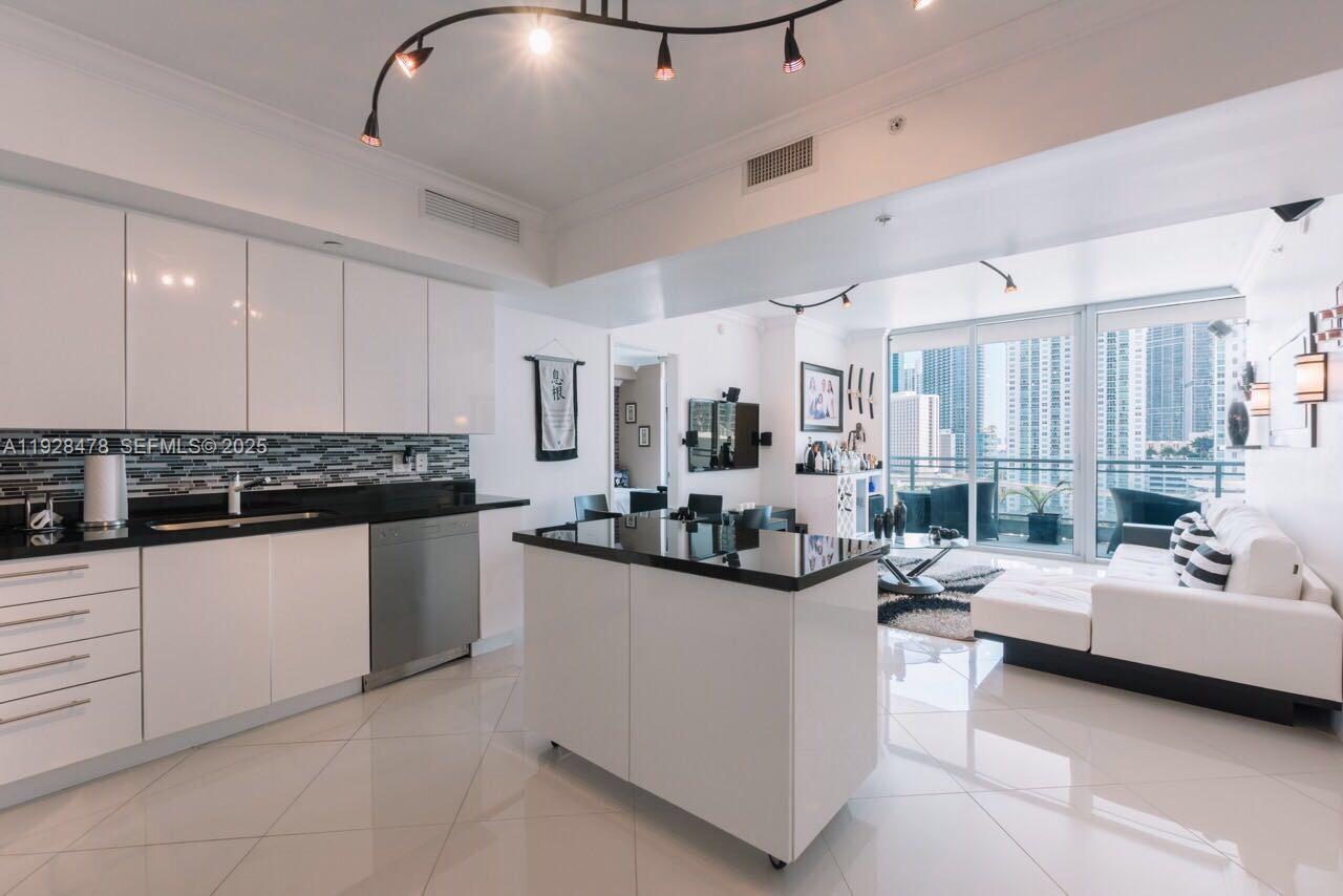 92 Southwest 3rd Street, Unit 1512 Miami, FL 33130 - Photo 4 of 15 a living room with furniture and a chandelier