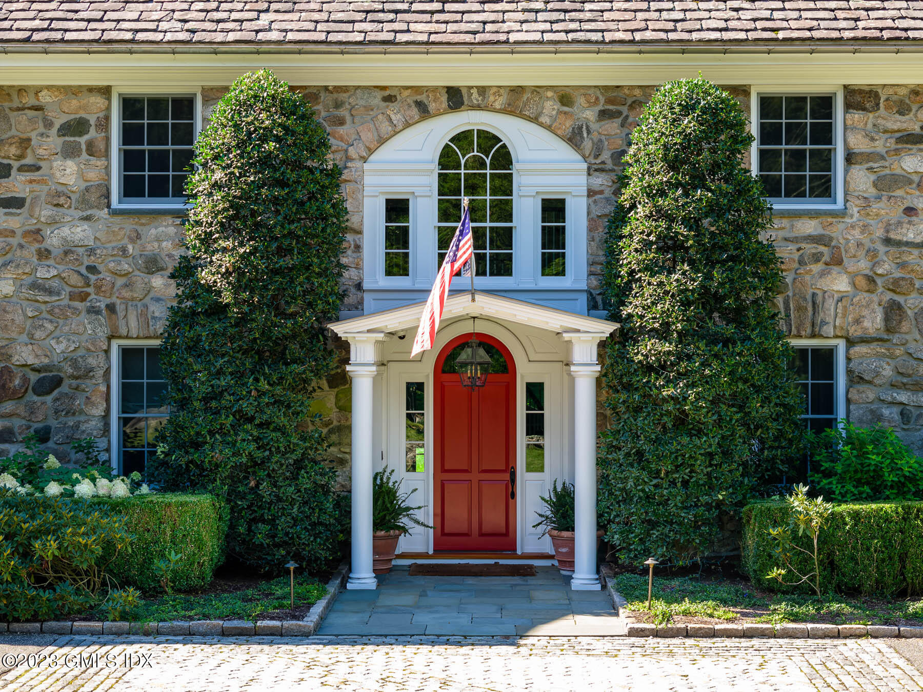 50 Dingletown Road Greenwich, CT 06830 - Photo 2 of 35 a front view of a house with a garden