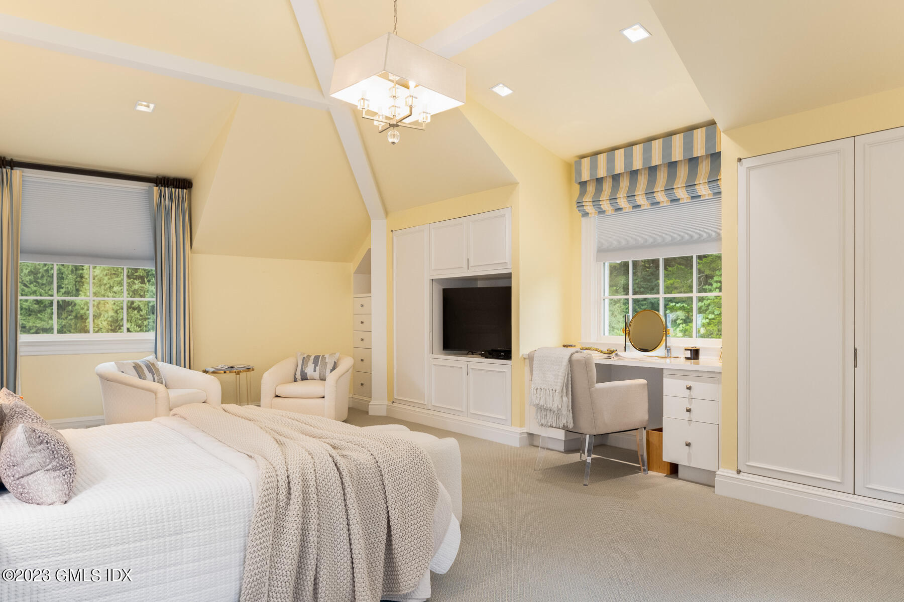 50 Dingletown Road Greenwich, CT 06830 - Photo 27 of 35 a bedroom with a bed and a chandelier