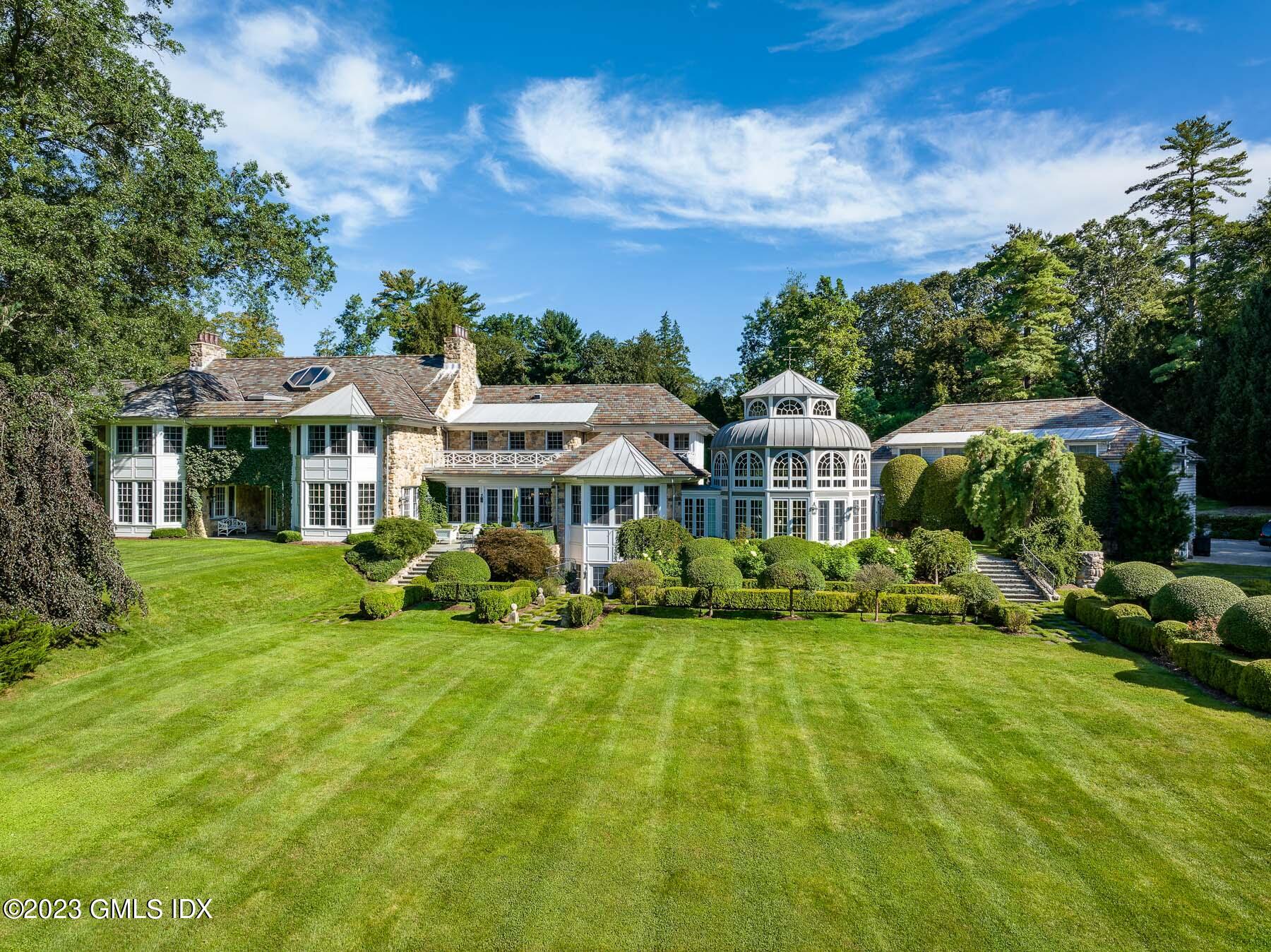 50 Dingletown Road Greenwich, CT 06830 - Photo 28 of 35 a view of a house with a big yard plants and large trees