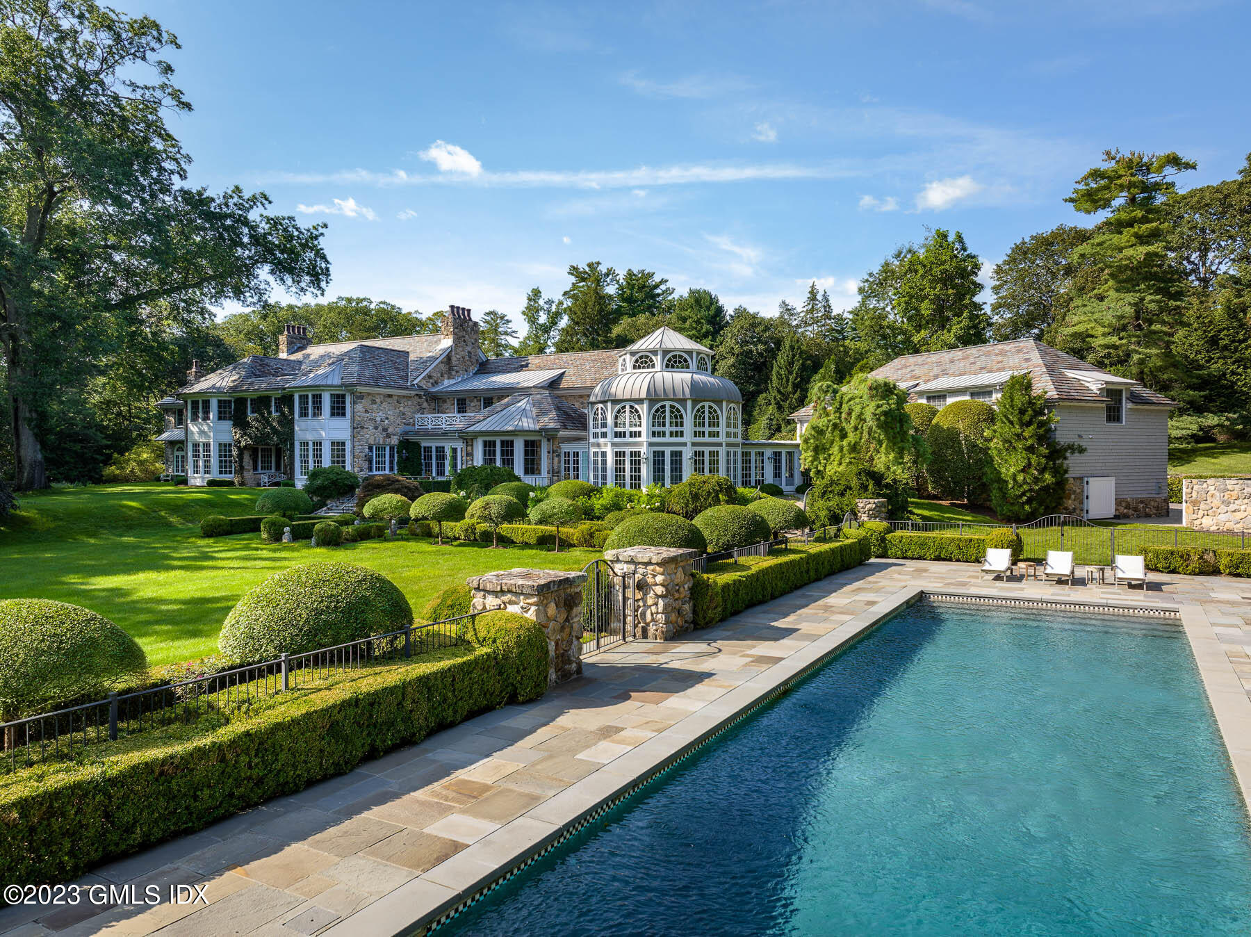50 Dingletown Road Greenwich, CT 06830 - Photo 31 of 35 a view of a house with swimming pool yard and outdoor seating