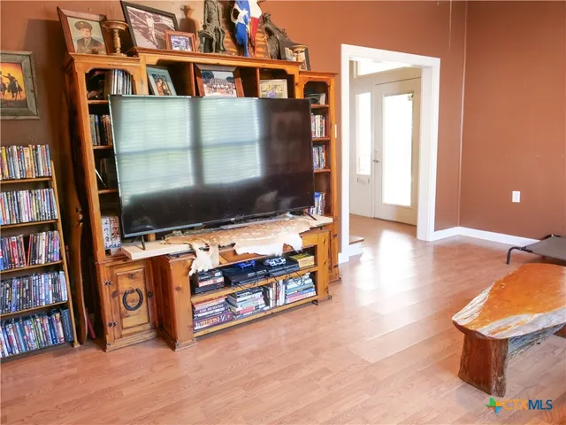 a bed room with a bed and a chair