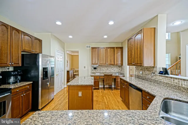 a view of a dining room with furniture large windows and wooden floor