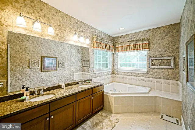 a bathroom with a toilet a sink and a mirror