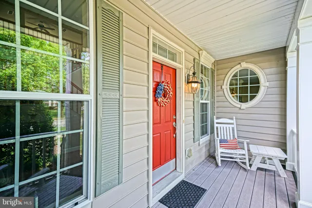 a view of entryway livingroom and hall with wooden floor