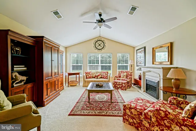 an aerial view of residential houses with outdoor space and street view