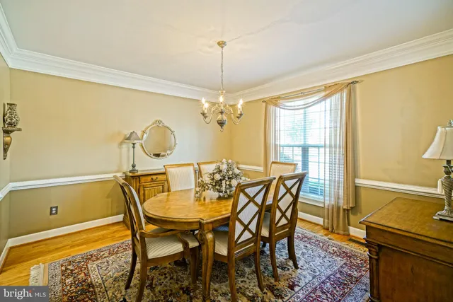 a kitchen with stainless steel appliances granite countertop a stove and a wooden floors