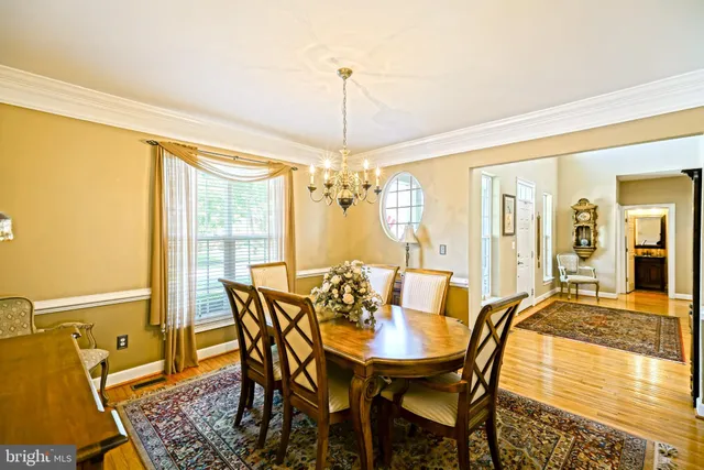 a kitchen with granite countertop a sink a counter top space stainless steel appliances and cabinets