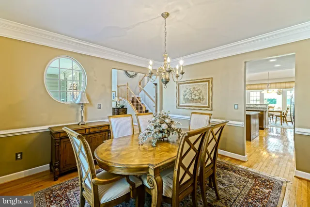 a kitchen with stainless steel appliances granite countertop a sink a stove and a counter space