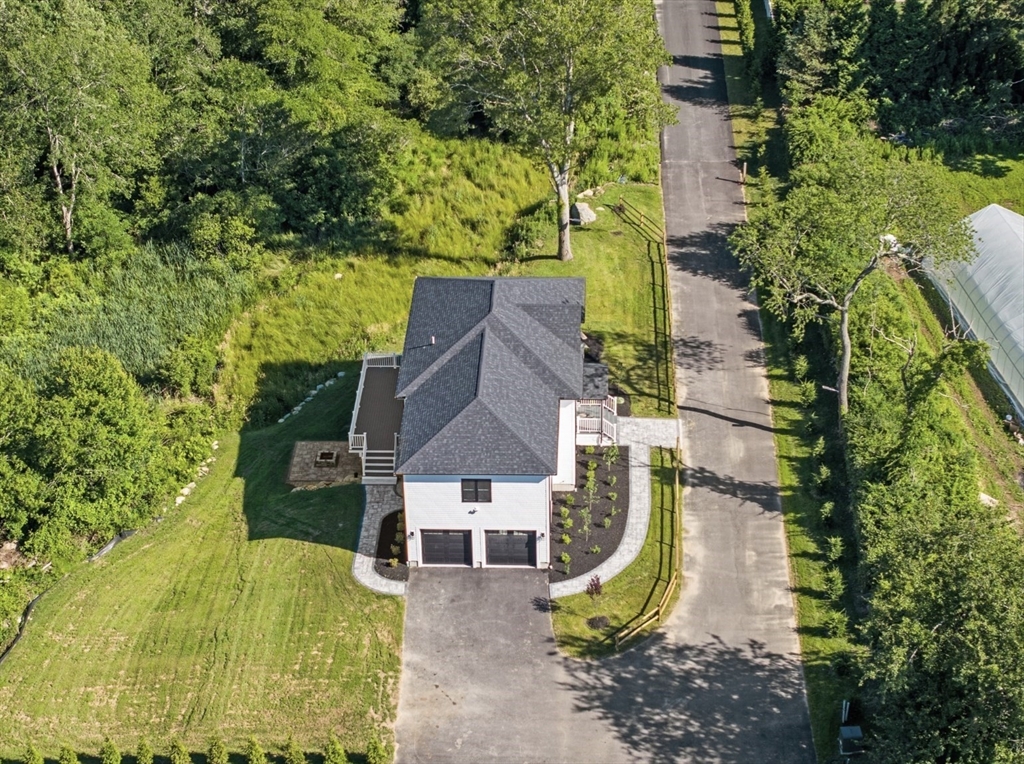 3 Morses Lane Acushnet, MA 02743 - Photo 8 of 42 an aerial view of a house with swimming pool and large trees