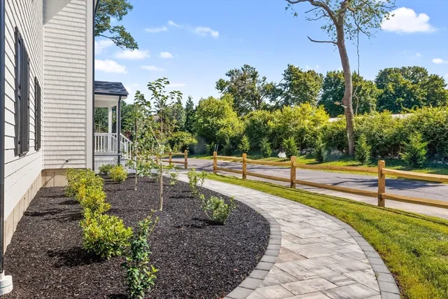 a view of a backyard with swimming pool