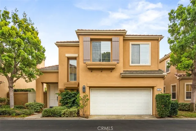 a spacious bedroom with furniture and a large window