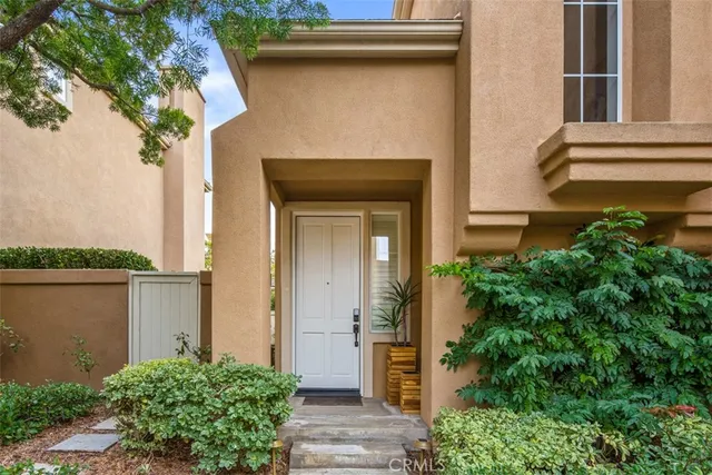 a kitchen with stainless steel appliances kitchen island granite countertop a table and chairs in it