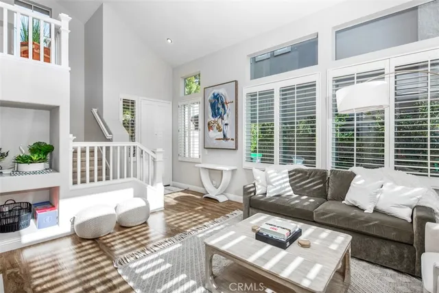 a kitchen with stainless steel appliances granite countertop a sink and a refrigerator