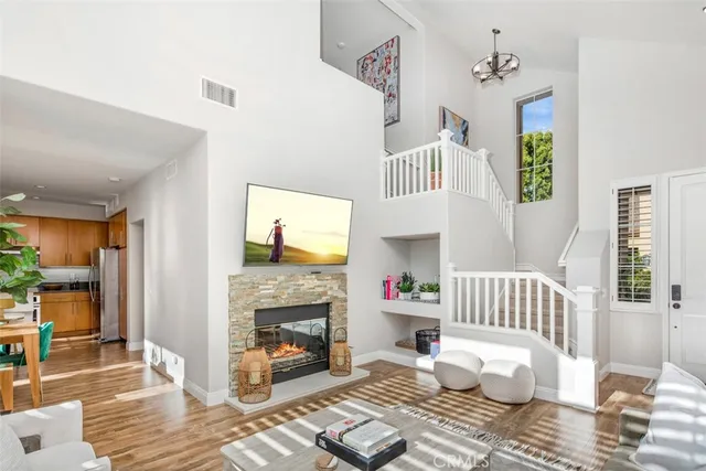 a kitchen with stainless steel appliances granite countertop a sink and a refrigerator