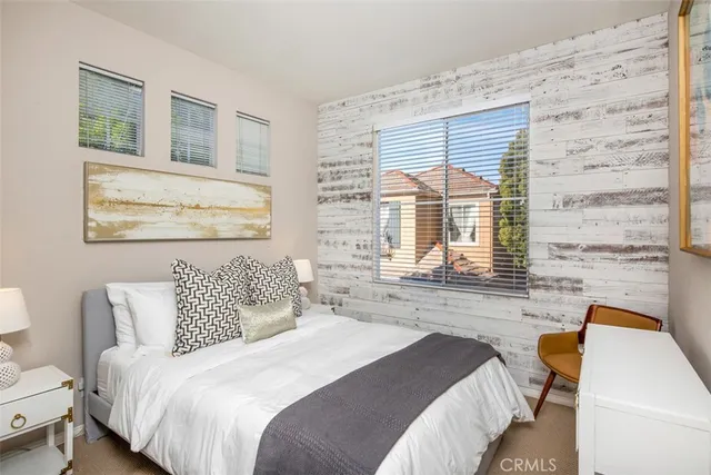 a bedroom with a bed and a walk in closet