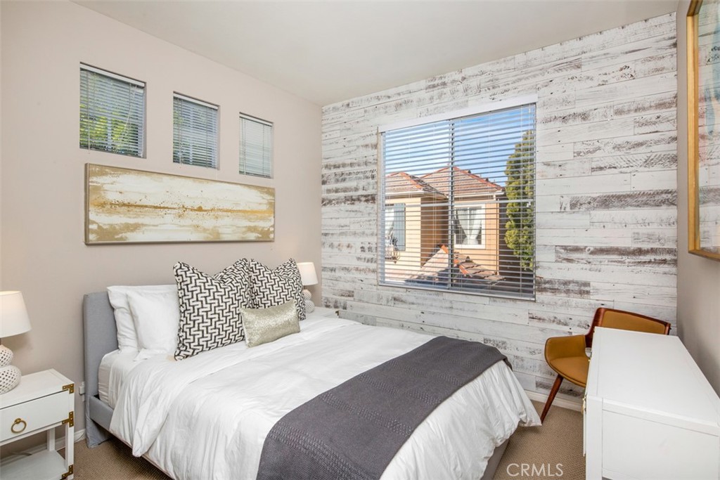 110 Lessay Newport Coast, CA 92657 - Photo 30 of 51 a bedroom with a bed and a large window