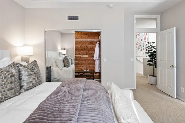 a bathroom with double vanity sinks and a mirror