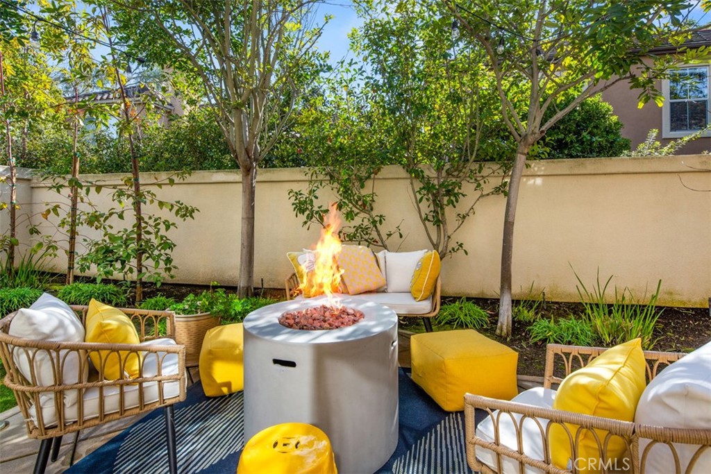 110 Lessay Newport Coast, CA 92657 - Photo 45 of 51 a view of a swimming pool with a chairs and table in the patio