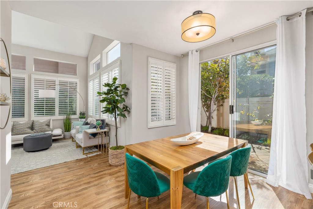 110 Lessay Newport Coast, CA 92657 - Photo 5 of 51 a view of a dining room with furniture wooden floor and chandelier