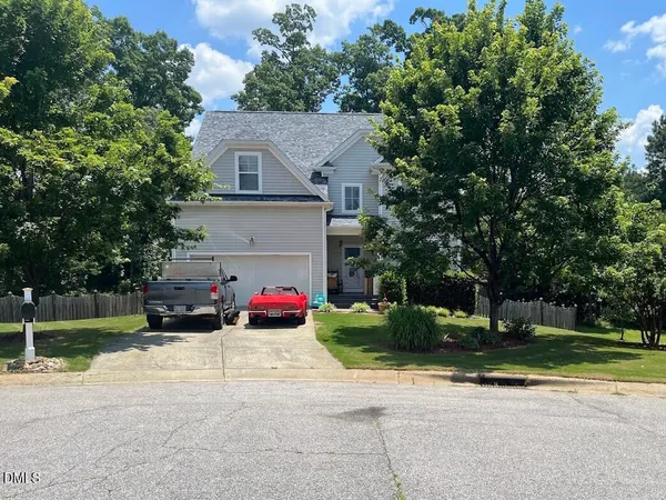 front view of a house with a patio and a yard