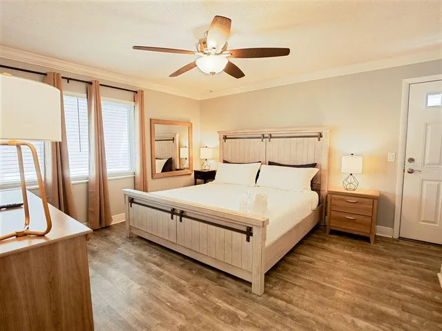 a large white bed in a white room