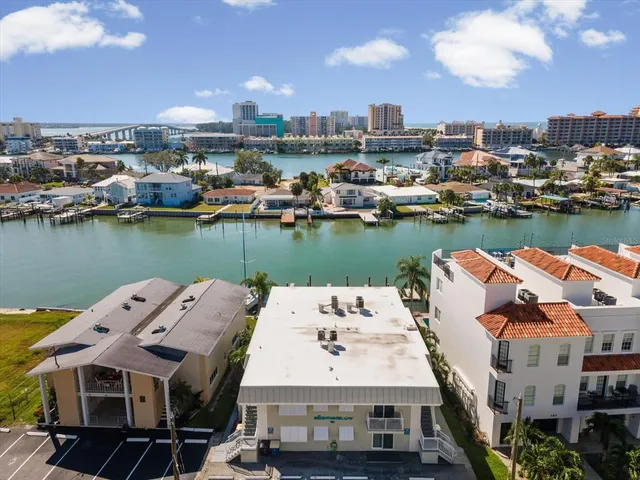 an aerial view of a house with outdoor space and lake view