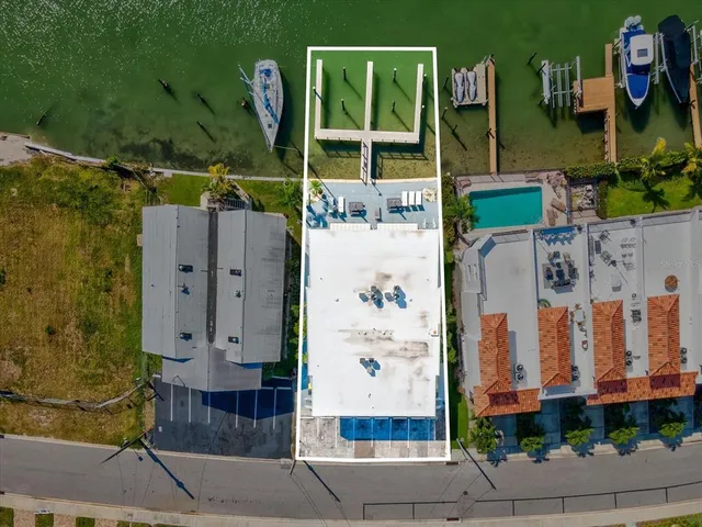 an aerial view of a house with a lake view