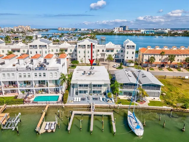 an aerial view of a house with a lake view