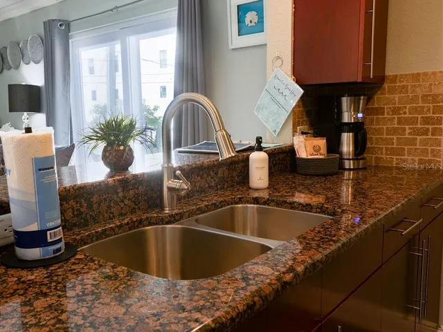 a kitchen with a sink and a window