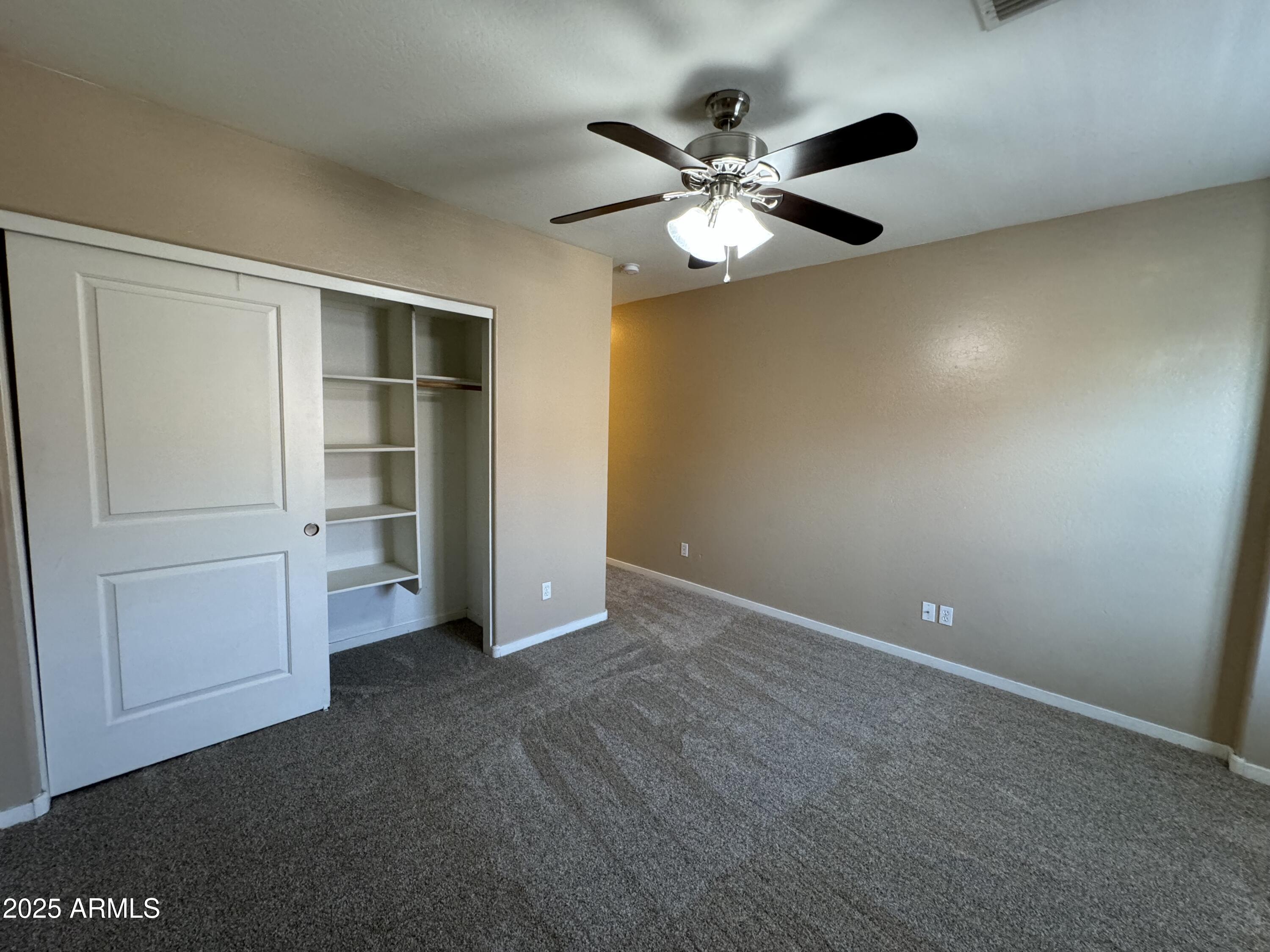 305 South Wilson Street, Unit 111 Tempe, AZ 85281 - Photo 32 of 48 an empty room with closet and mirrors