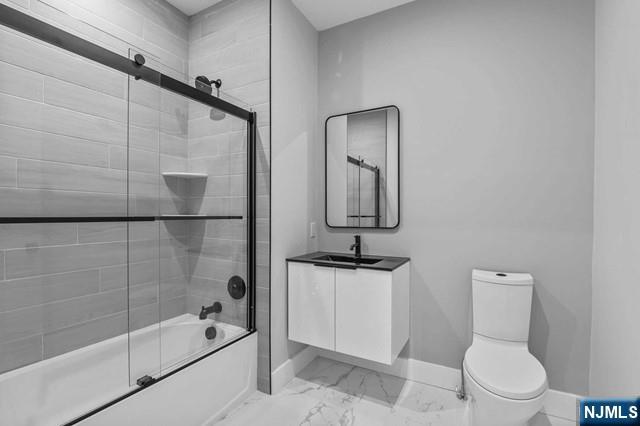 2021 Jones Road, Unit 203 Fort Lee, NJ 07024 - Photo 7 of 10 a bathroom with a toilet sink vanity tub and mirror