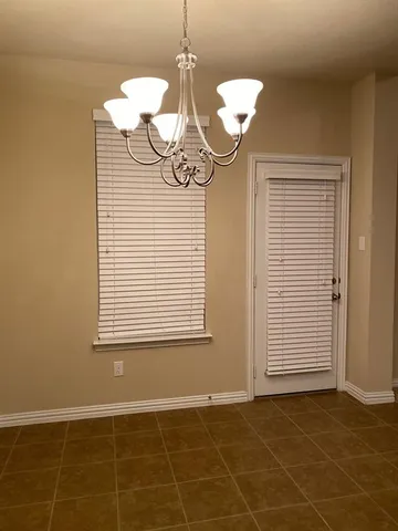 a kitchen with stainless steel appliances granite countertop a refrigerator a stove a sink and dishwasher